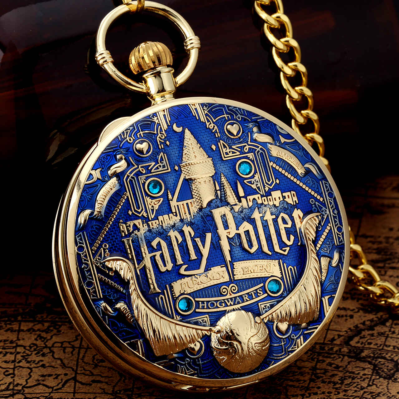 Relógio de Bolso e Caixinha de Musica Brasão Hogwarts: Corvinal Ravenclaw Pomo de Ouro Harry Potter Dourado e Azul - MKP